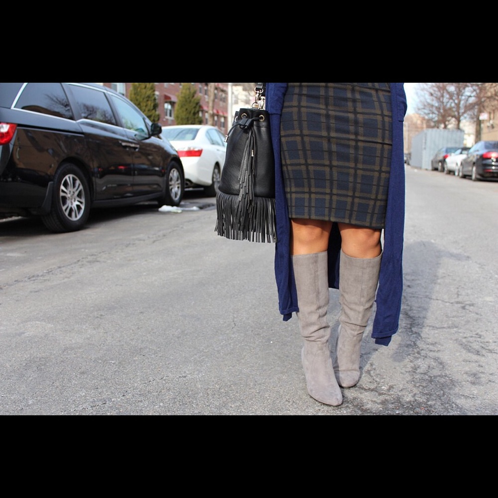 Below the knee pull up gray boots.